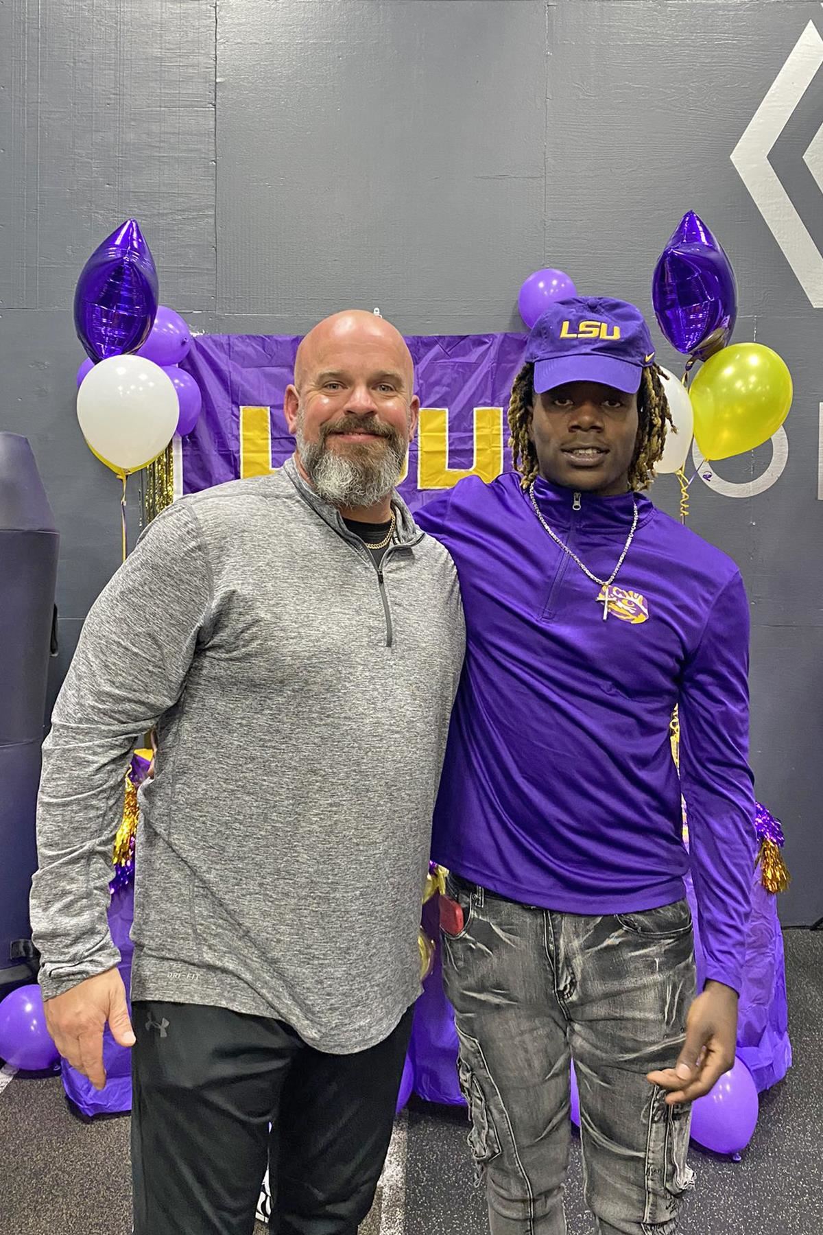 Cypress Ranch High School senior Christian Brathwaite, right, signed a letter of intent to Louisiana State University.